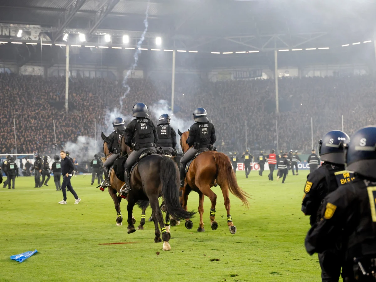 Pitch invasion disrupts high-risk German Cup match, injures over 100