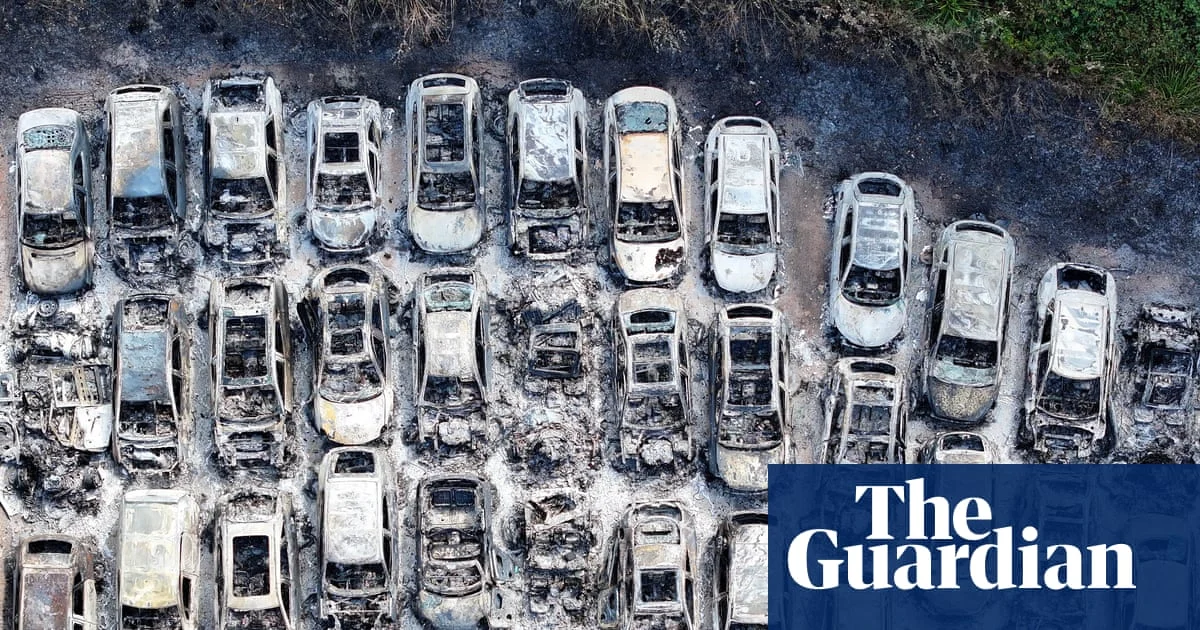 Man arrested after fire destroys 140 cars near Gatwick